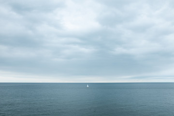 TINY BOAT ON THE SEA