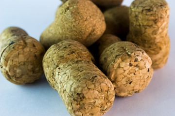 Brown corks from champagne close up photographed from the side on white