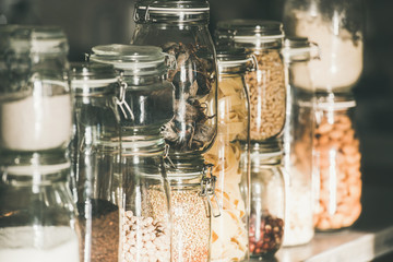 Grains, cereals, nuts, dry fruit, pasta in glass jars