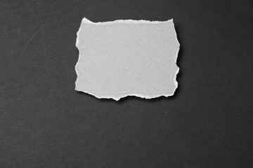 paper note  ripped on the dark background