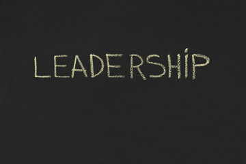 Leadership word handwriting on blackboard, copy space