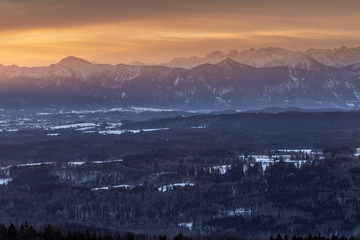 Sunrise at the Hohenpei&szlig;enberg, a mountain in Bavaria. A perfect view zo the bavarian alps with red morning glow in the sky.
