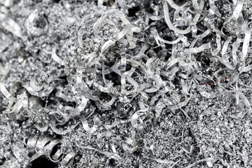 Metal shavings, iron shavings close-up. Recycling material from the manufacturing process. 