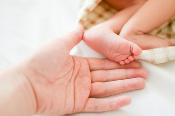 Newborn baby feet and fingers