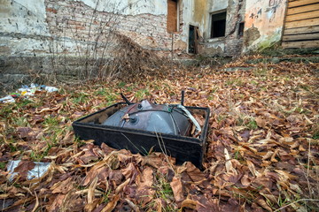 Damaged television in the backyard