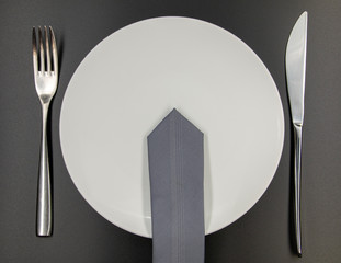 business lunch, dish, fork and knife, table, black background, tie