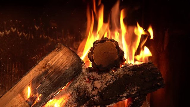 A fire burns in a fireplace close-up