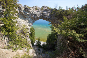 Mackinaw Island Arch Rock. The famous natural landmark Arch Rock is an ancient geological formation on the coast of Lake Huron  on Mackinac Island in Michigan.