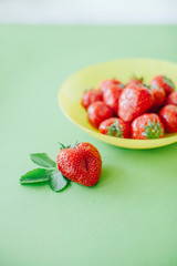 Fresh red strawberry in a plate. 