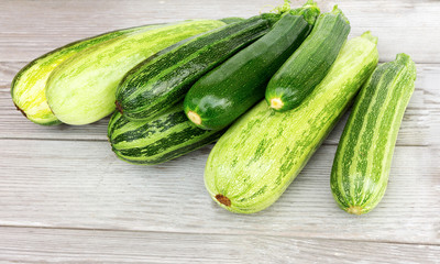 Zucchini. Fresh zucchini or courgette on wooden.