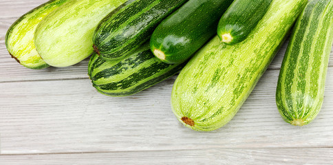 Zucchini. Fresh zucchini or courgette on wooden.