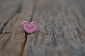 Fototapeta premium One Heart on wooden background. Copy space Valentines.