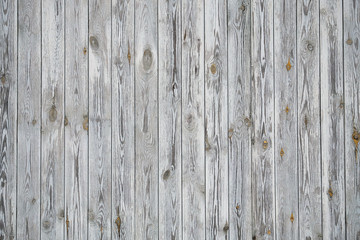 Naklejka premium Background texture of old grey painted wooden lining boards wall. Vertical wooden texture.