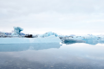 Fototapeta na wymiar reflection of blue ice at jokulsarlon, iceland