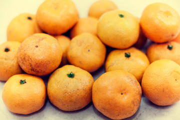 Fresh whole mandarin oranges background , top view.