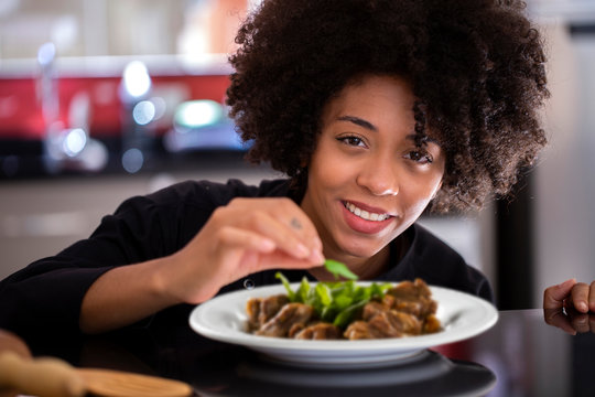 African female chef preparing in kitchen