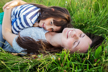  mother and child are having fun in the mountains