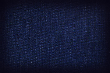 View of the weave. A closeup of a piece of denim fabric.