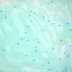 Background from transparent liquid cosmetic scrub isolated on white background