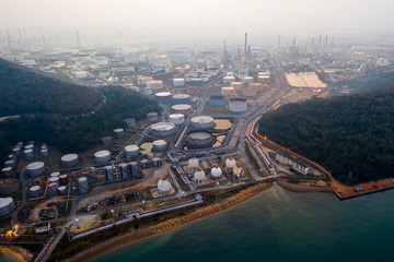 Obraz premium Aerial view. oil refinery factory and Oil industry at sunrise. Petrochemical Industrial.