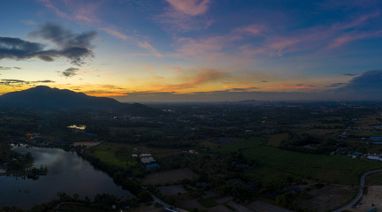 Aerial view. of sunset or sunrise and blue sky on the mountains Twilight sky.