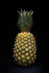 Fresh pineapple on black background - isolated