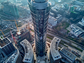 Fototapeta WARSAW, POLAND - NOVEMBER 27, 2018: Beautiful panoramic aerial drone view to the center of Warsaw City and The Warsaw Spire - 220 metre neomodern office building on European square (Plac Europejski) obraz