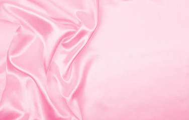 Obraz na płótnie Canvas Smooth elegant pink silk or satin texture as wedding background. Luxurious valentine day background design