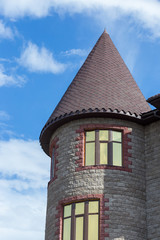 Fototapeta na wymiar Manor Tower on a background of blue sky