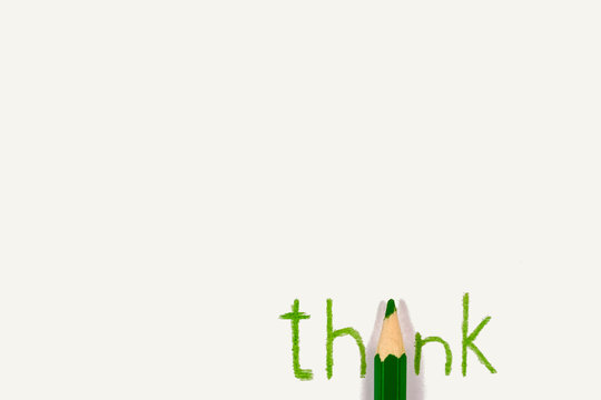 Word Think written with green pencil. Concept of brainstorming