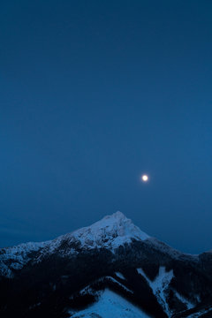 Velky Rozsutec 1609.7 m (5281.17 ft ) is a mountain situated in the Mala Fatra mountain range in the Zilina Region, Slovakia. Night Sky with moon shining mountain view.