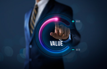 Growth value, increase value, value added or business growth concept. Businessman is pulling up circle progress bar with the word VALUE on dark tone background. - obrazy, fototapety, plakaty