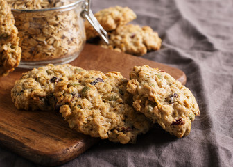 Homemade oat cookies on dark grey or brown background