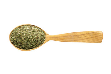 dried mint in wooden spoon isolated on white background. spice for cooking food, top view.