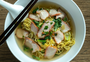 Red pork noodles ,bowl of noodles with vegetables
