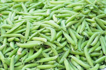 Macro details of fresh Green peas  at street side vegetable market in India 