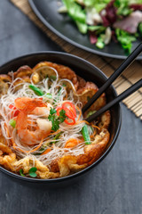 Thai style rice noodles salad with shrimps and omelette, cloxe view selective focus