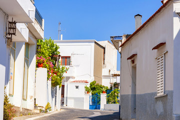 Fototapeta na wymiar Greek streets with white houses