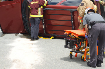 Fototapeta na wymiar emergency team on the road, car accident vehicle damage crash rescue litter accident
