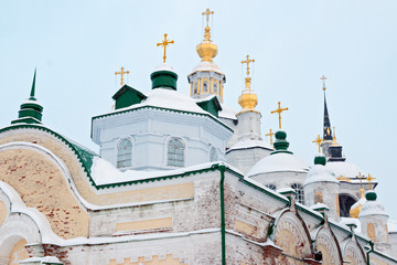 Golden domes of orthodox church in winter against the blue sky background, Veliky Ustyug, Russia