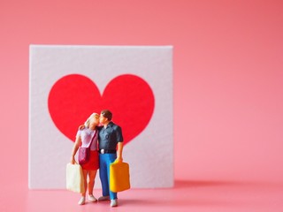 Miniature people in valentine concept.