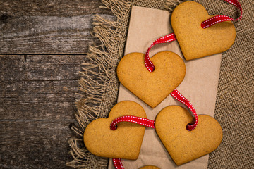 Valentines Day Background. Valentines Day Heart Shaped Cookies on Wooden Background. Selective focus.