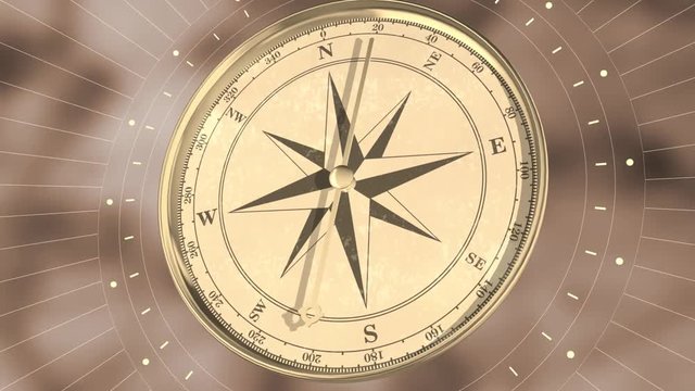 Vintage gold compass on blurred motion background. Retro stale