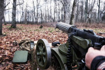 Fototapeta na wymiar retro machine gun in the forest
