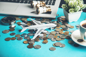 airplane with  coins on keyboard