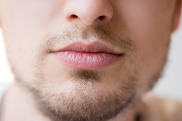 Naklejka premium Young man with red lips and beard