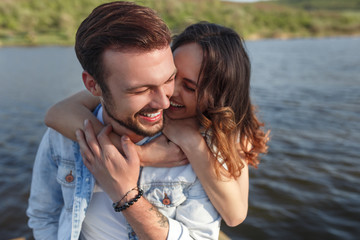 Embracing laughing couple in nature