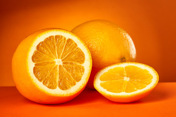Fresh orange fruit on color background. 
