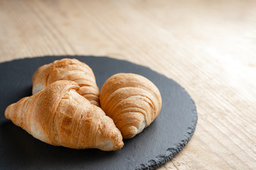 Croissants on the Board slate. copy space