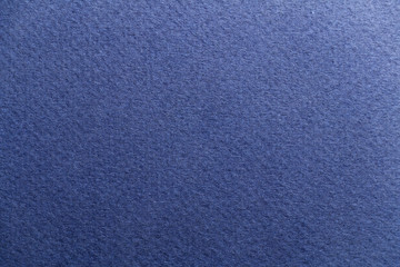 The texture of the rough blue canvas